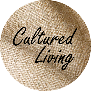 Cultured Living Logo with the words Cultured Living on a circular hessian background